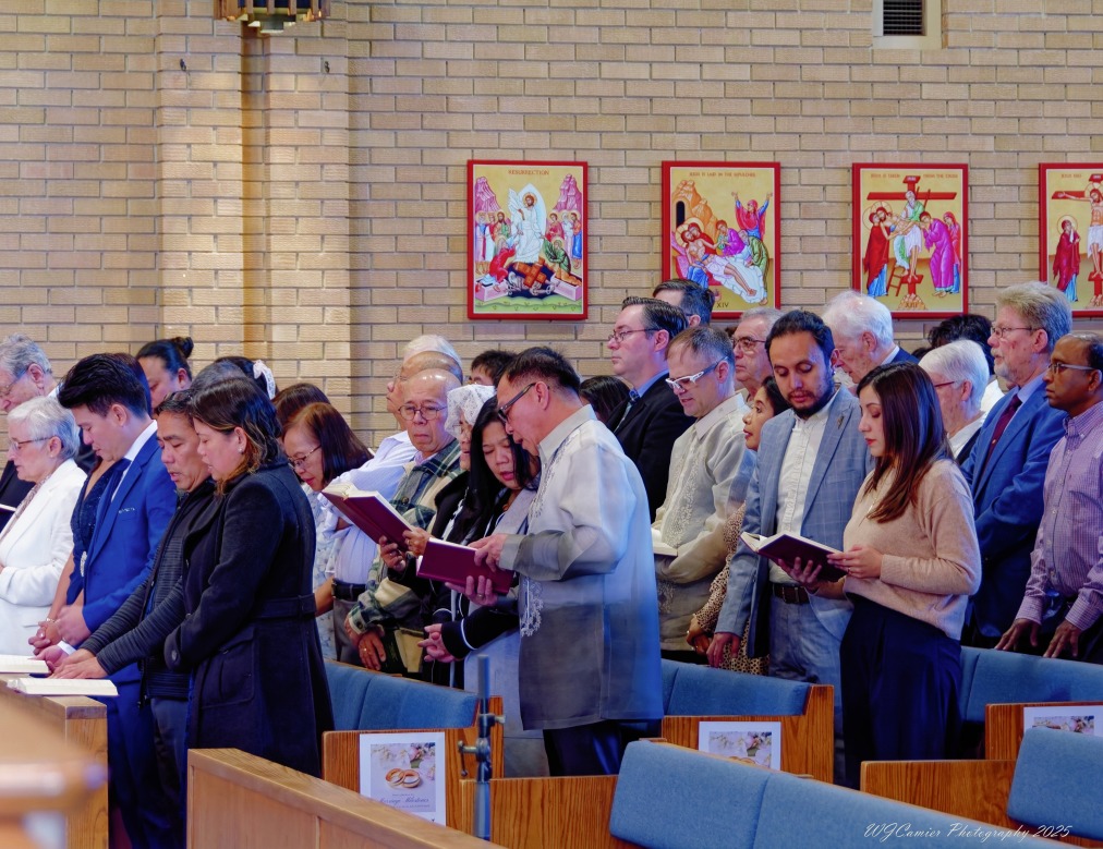 Congregation gathered in prayer and worship inside the church